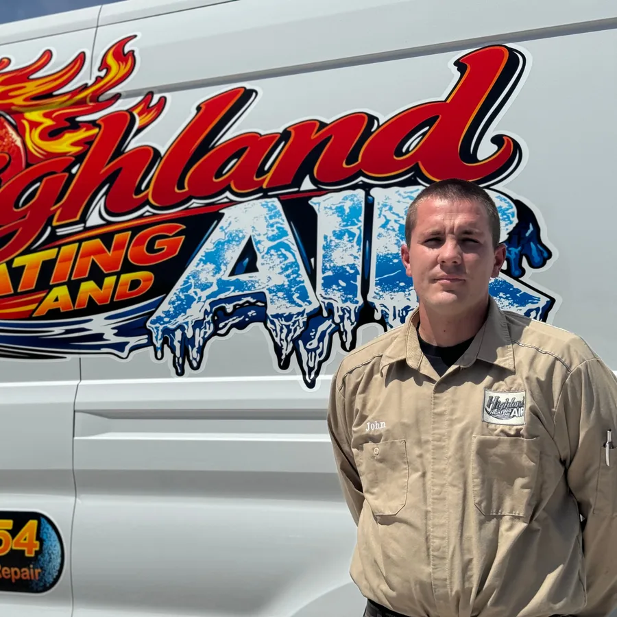 Owner John Beech standing beside the Highland Heating & Air service van in Highland, CA